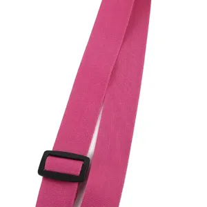 Close-up detail showing the adjustable pink webbing strap and black buckle for a child bag