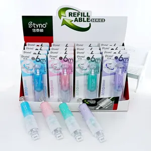 Assorted colors of press-type dot glue tape pens displayed in retail packaging box