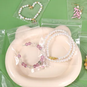 Close-up of clear PP zip lock bags protecting necklaces and earrings from oxidation