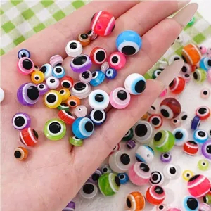 Detailed close-up of colorful resin evil eye beads with rainbow stripes for DIY jewelry making
