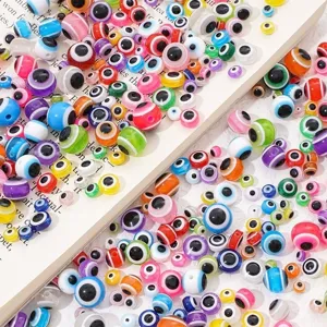 Detailed view of colorful rainbow striped resin evil eye loose beads for DIY jewelry