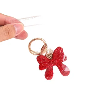 High transparency PP self-sealing bag for jewelry storage shown with a red bow keychain