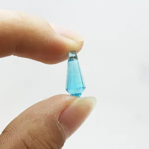 Macro detail of 6x15mm light blue faceted teardrop glass beads for DIY jewelry