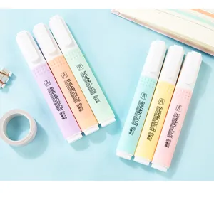 Close-up of six pastel-colored highlighter pens on a light blue background