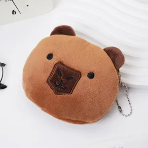 Close-up of a cute brown plush capybara coin purse with embroidered details and chain