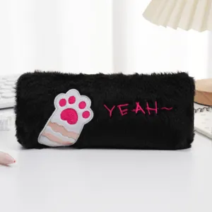 Detailed view of the fuzzy black plush pencil case with cute pink cat paw embroidery