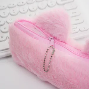 Detailed view of the soft pink plush texture and smooth zipper on the cat pencil case