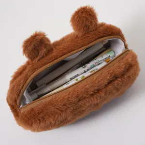 Detailed view of the spacious interior compartment of a cute brown plush capybara pencil case.