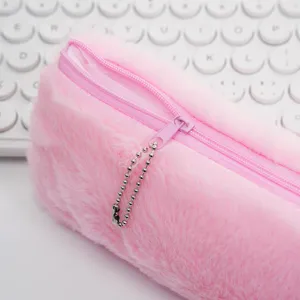 Detailed close-up of a pink fluffy pencil case showing soft plush texture and purple zipper