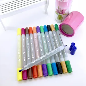 Close-up of dual-tip washable watercolor pens in vibrant colors with storage tube