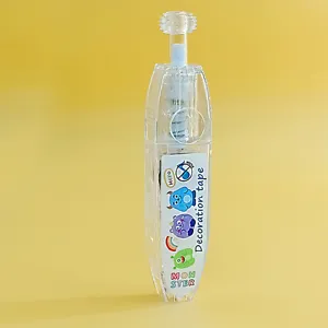 Gros plan du stylo ruban décoratif transparent avec motif de monstre coloré pour DIY