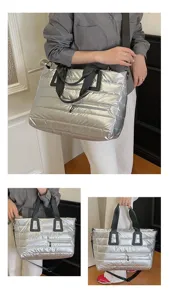 Detailed views of a large silver metallic quilted puffer tote bag with black straps.