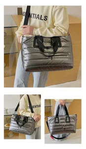 Detail of metallic silver puffer tote bag showing large capacity and stylish horizontal quilting
