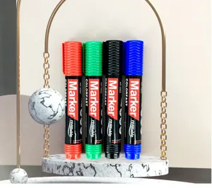 Close-up shot of four colored refillable permanent markers displayed on a marble stand