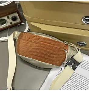 Detailed view of the sporty orange grid and beige crossbody chest bag for outdoor and casual use.