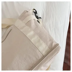 Large capacity casual shoulder travel bag for women, lightweight nylon commuting bag.