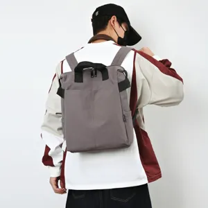 Mochila gris minimalista versátil de gran capacidad para uso diario, escuela y viajes