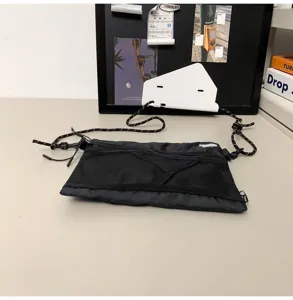 Streetwear black mesh crossbody bag with durable rope strap for outdoor hiking