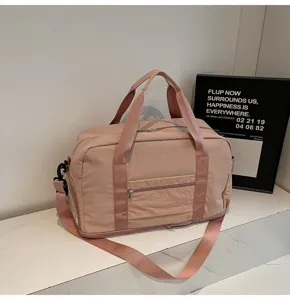 Macro view of a stylish pink expandable travel duffel bag for fitness or business trip