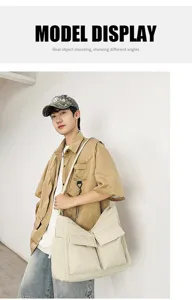 Model wearing a large off-white canvas messenger bag with double front pockets