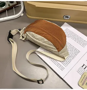 Sporty checkered chest bag in orange and beige tones, lifestyle layout on magazine.