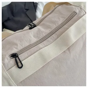 Detailed view of the large capacity travel duffel bag showing durable zipper and wide strap.