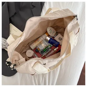 Detailed view of beige travel duffel bag interior, showing large capacity and durable fabric.