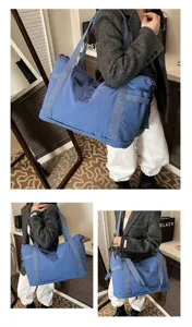 Large capacity travel duffel bag for women, lightweight casual shoulder luggage for gym.