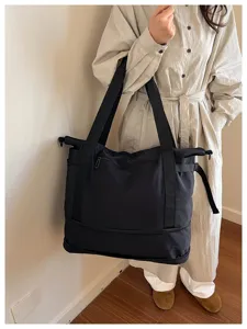 Large capacity black shoulder travel bag, lightweight daily commuting and gym tote for women.
