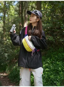 Outdoor lifestyle shot of vibrant dopamine-colored crossbody bag in forest setting