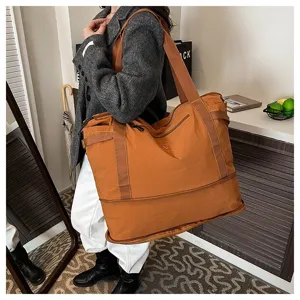 Large capacity travel duffel bag for women, lightweight casual shoulder luggage for short trips.