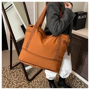 Large capacity travel duffel bag for women, lightweight waterproof weekender bag, shoulder luggage.