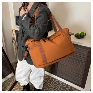 Large capacity travel duffel bag for women, lightweight nylon weekender bag for short trips.