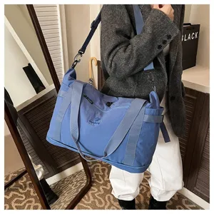 Large capacity blue travel duffel bag, lightweight shoulder bag for women daily commute and trips.