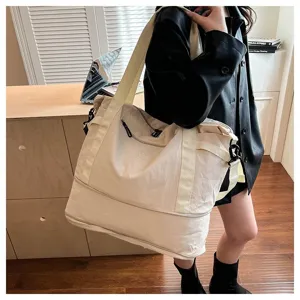 Large capacity travel duffel bag for women, lightweight weekender overnight bag with strap.