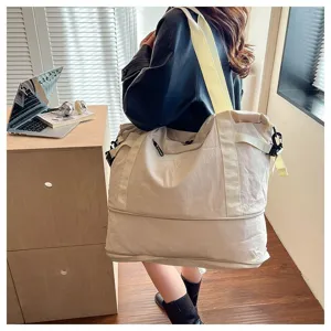 Large capacity travel duffel bag for women, lightweight casual shoulder luggage bag for weekend trips.