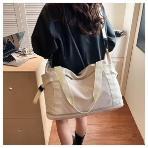 Large capacity travel duffel bag for women, perfect for short trips, commuting and gym use.