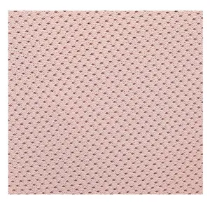 Detailed close-up showing the breathable pink honeycomb mesh texture of the backpack