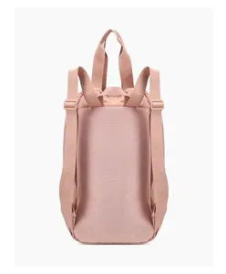 Detailed back view of a dusty rose nylon backpack with breathable mesh and straps.