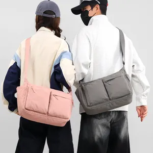 Large capacity multi-pocket messenger bag in pink and grey for casual outdoor and sports use