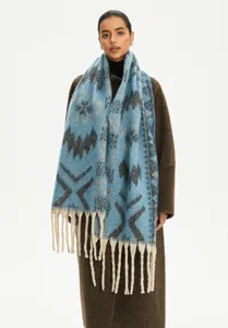Detail shot of blue faux mohair scarf with ethnic jacquard pattern and long tassels