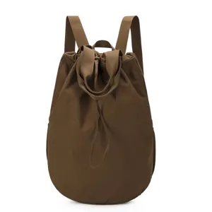 Minimalist brown nylon drawstring backpack for casual travel and daily use