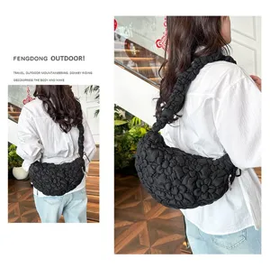 Chic black bubble texture cloud shoulder bag shown on model in a casual setting