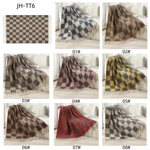 Collage of faux mohair plaid blankets with tassels in eight different color variants