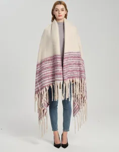 Full view of a thick boucle yarn shawl with tassels and red striped pattern on model