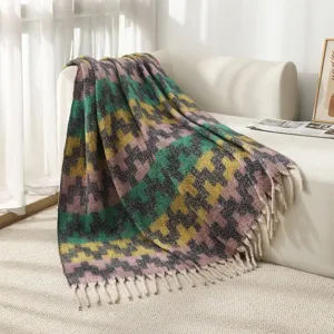 Cozy faux mohair throw blanket featuring colorful ethnic geometric patterns and tassels.