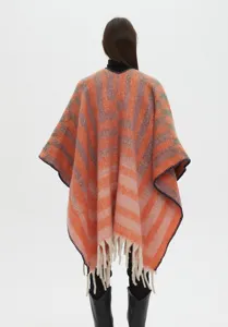 Back view of a thickened jacquard striped shawl in orange with tassel fringe