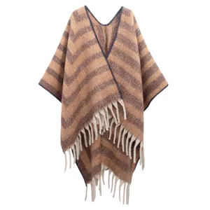 Detailed view of the thick faux mohair striped shawl with elegant fringe tassels