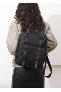 Retro-Rucksack für Damen aus schwarzem Leder mit braunen Riemen und praktischem Griff