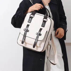 Stylischer Vintage-Rucksack in Creme für Damen mit klassischen dunkelbraunen Riemen und Schuldesign